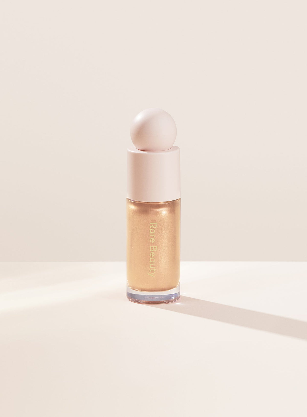 Rare Beauty Positive Light Liquid Luminizer – Exhilarate (champagne gold), 15 ml